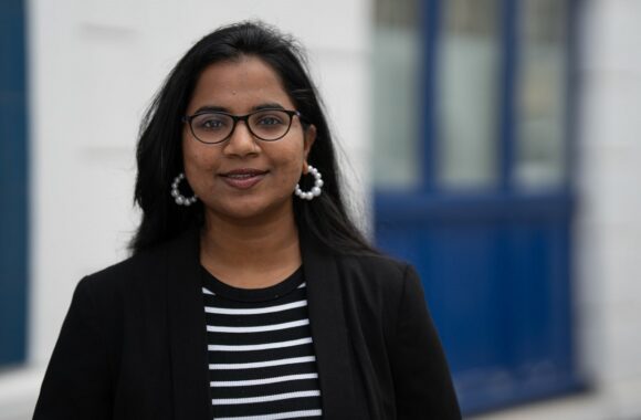 Look Ahead's Fundraising and Partnerships Manager Dipti dressed smartly and standing outside a service.